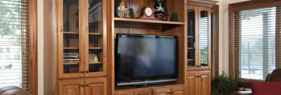 /bespoke-kitchens/pine-by-design-case-studies/fitted-living-room-units-to-house-a-full-cinema-system-with-plenty-of-storage-and-display-space